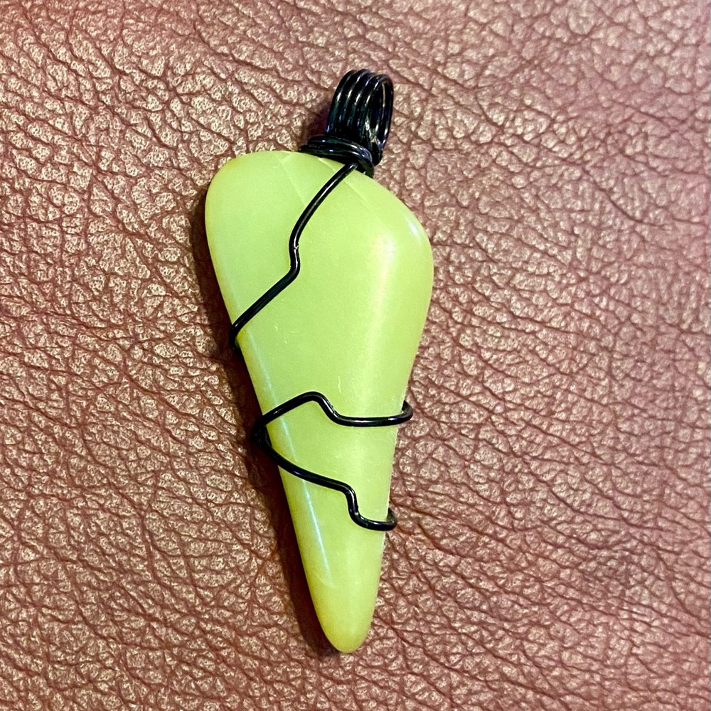 Wire wrapped healerite pendant.